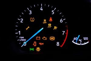 A,Car's,Dashboard,Lights,Up,With,Multiple,Alert,Icons,,Signaling