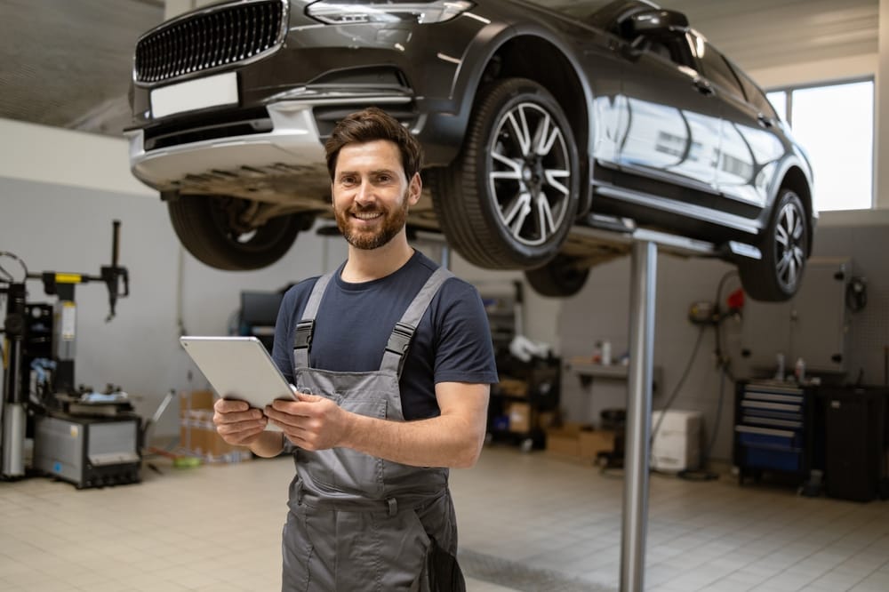 Professional technician checking vehicle diagnostics and maintenance